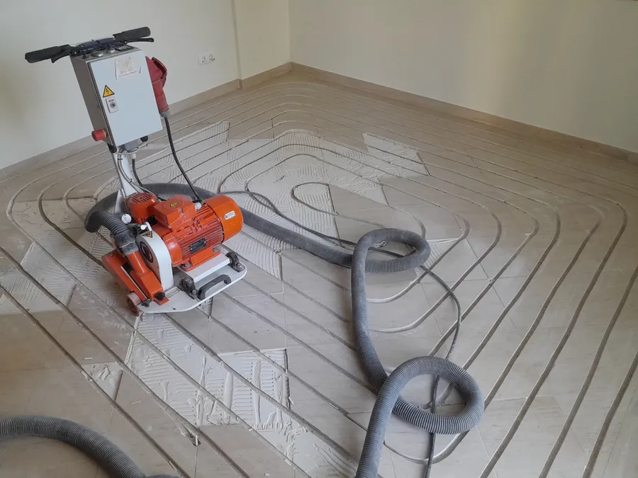 The milling machine positioned on an existing tiled floor, ready to cut