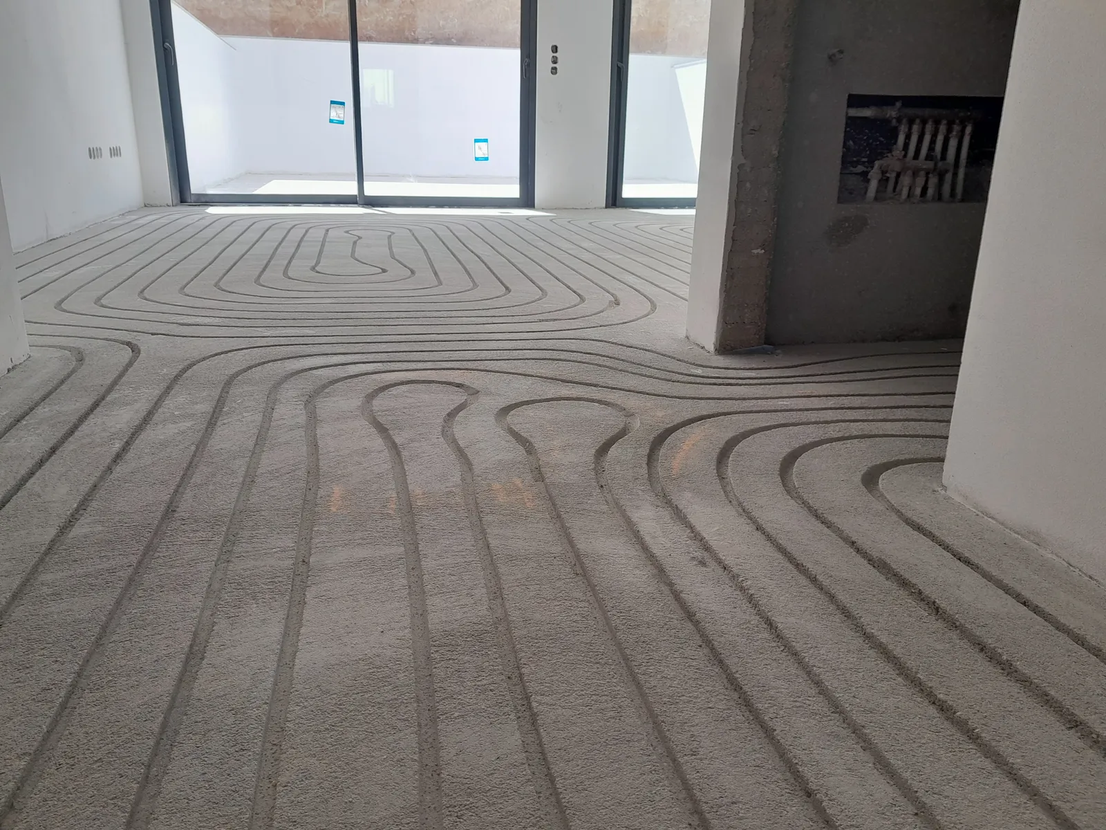 Milled channels across a large open-plan villa floor