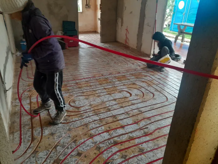 Two team members working on milled channels on site